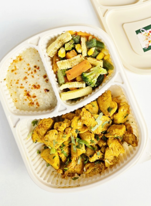 A Diet King meal tray with grilled chicken, vegetables and rice
